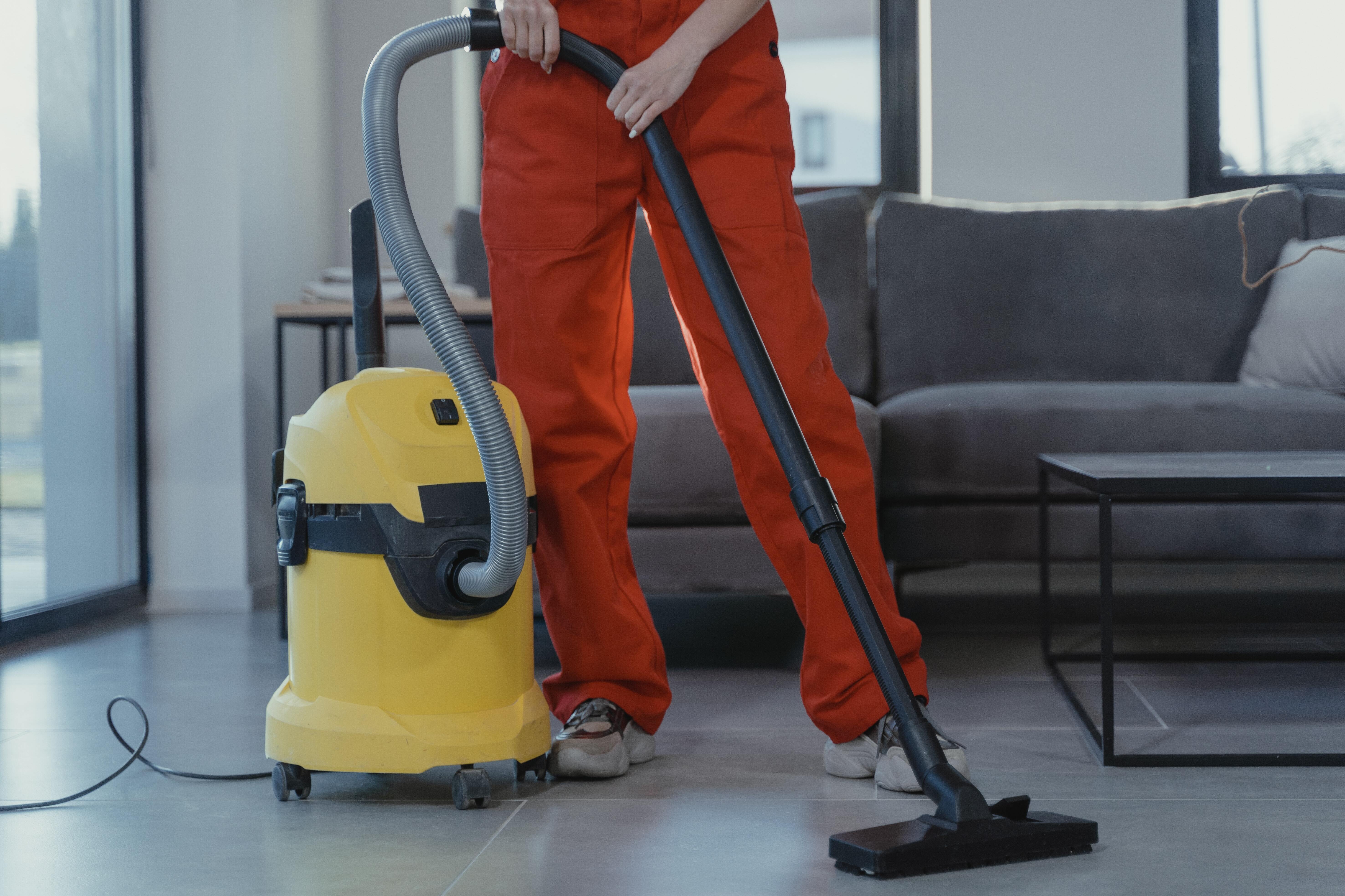 A cleaner carrying out deep cleaning in preparation for the arrival of short let guest